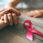 hands with pink ribbon